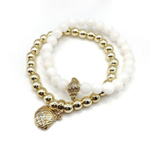 Kép betöltése a galériamegjelenítőbe: Kagylós arany hematit és fehér angelit karkötő szett